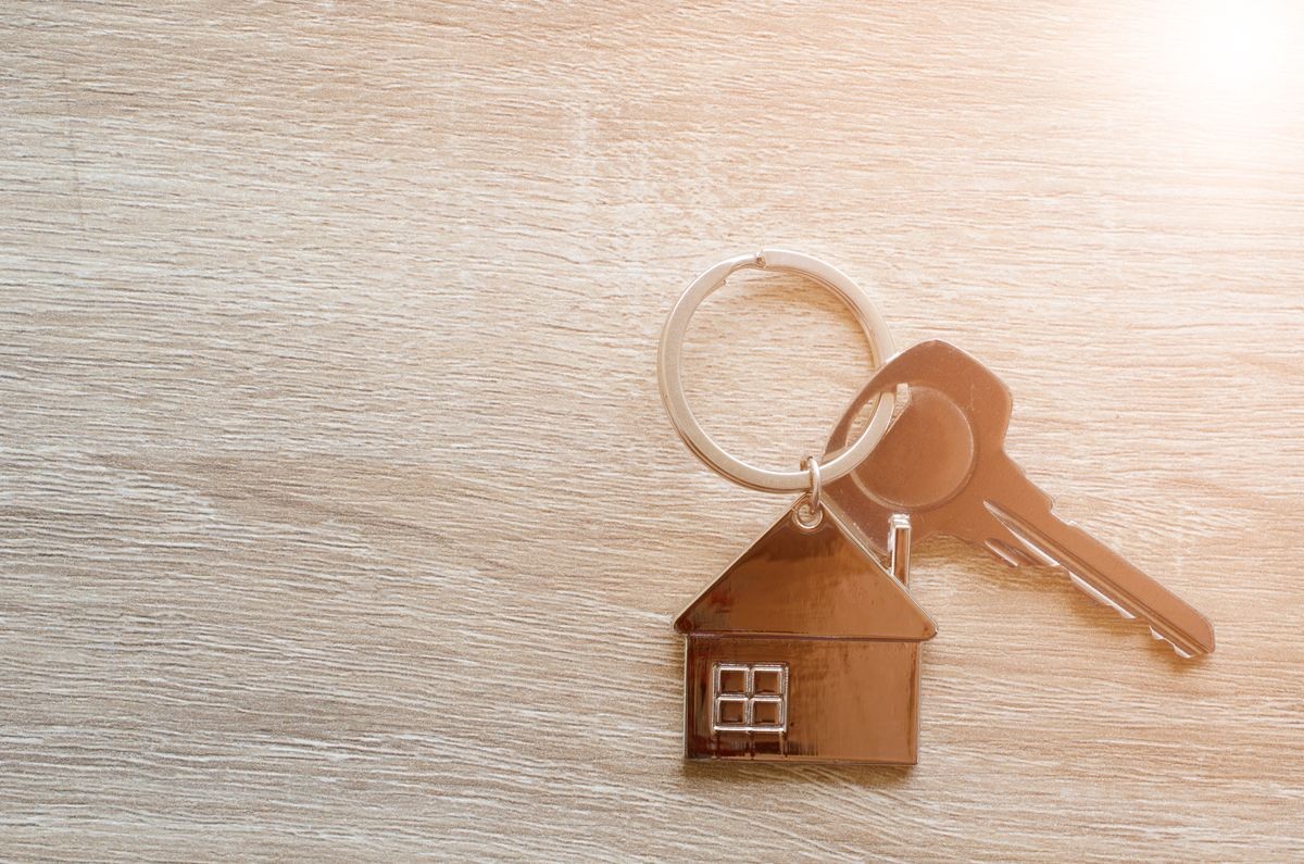 House key on wood background. housing and real estate, insurance concept. House key on wood background. housing and real estate, insurance concept.